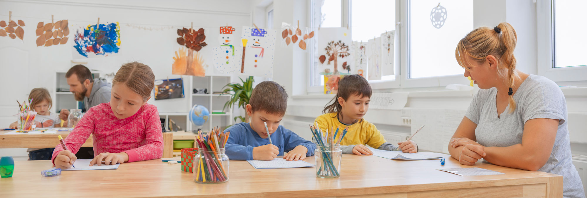 Elementary School classroom with kids and teacher